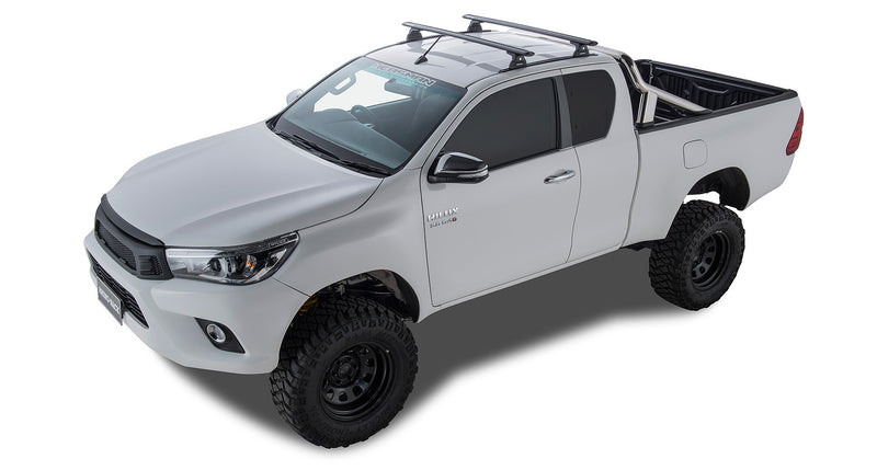 Vortex RLT600 Extra Cab roof bars – installed Hilux view. Supplier photographs show the Extra Cab roof-bar installation. The vehicle, tub and unrelated accessories pictured are not included.