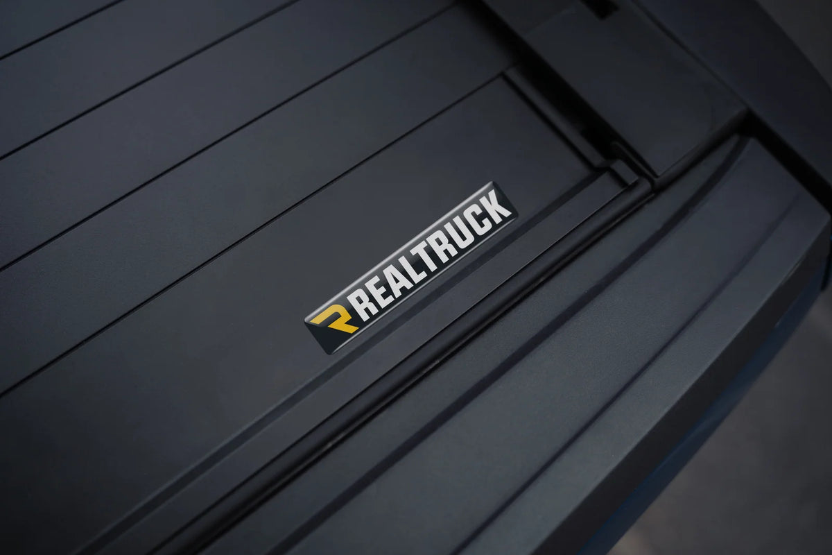 Close-up of Mountain Top electric roll cover finish and branding