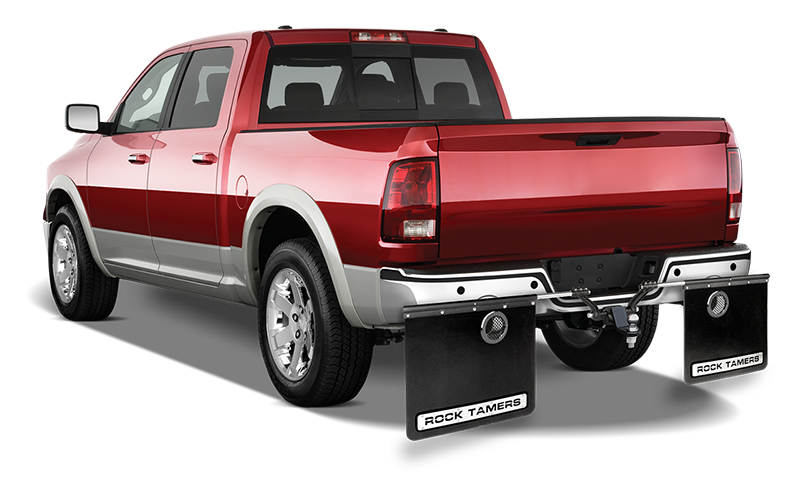 Rock Tamers exhaust outlets installed on a vehicle's mudflaps, angled view