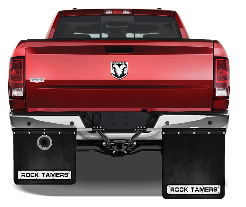 Rock Tamers exhaust outlets installed on a vehicle's mudflaps, rear view